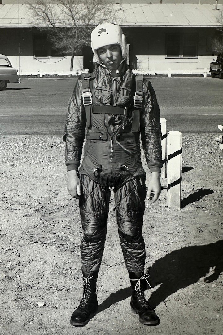 Coy Martin in Navy jumpsuit preparing for flight.