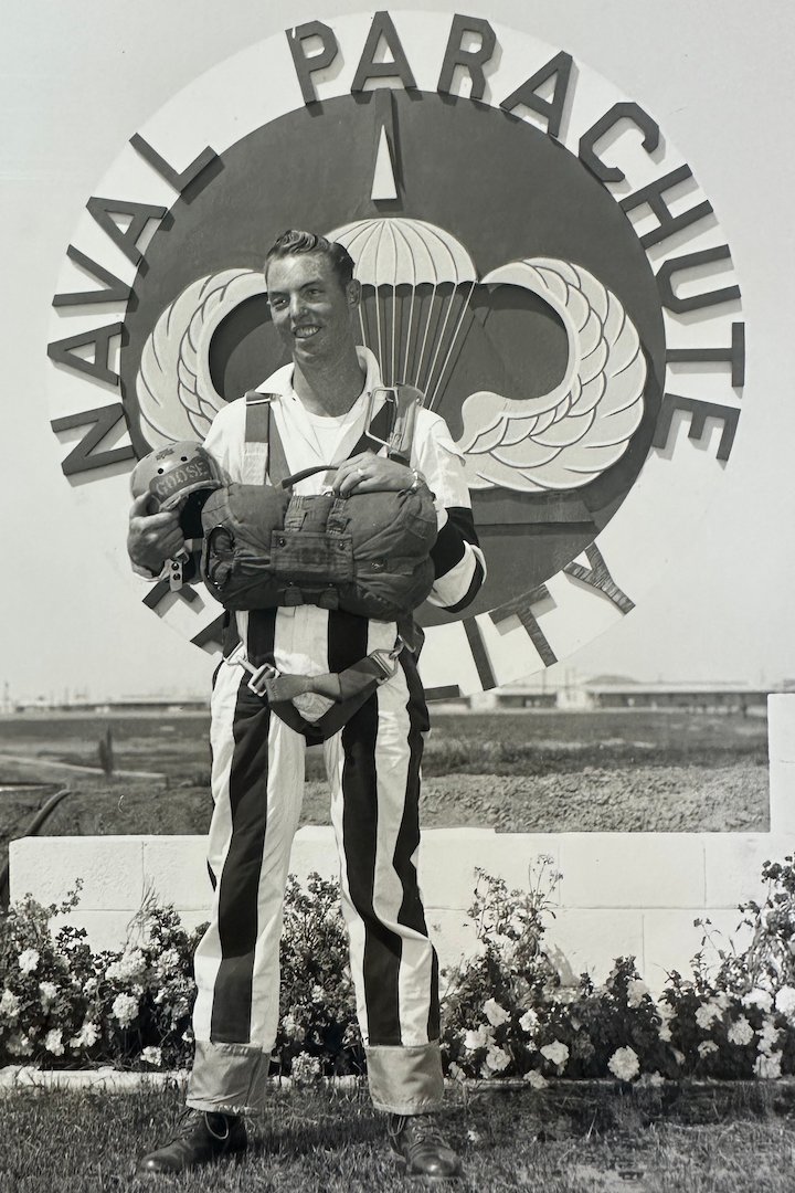Coy Martin posing outside the Navy Parachute Facility in full jump gear.