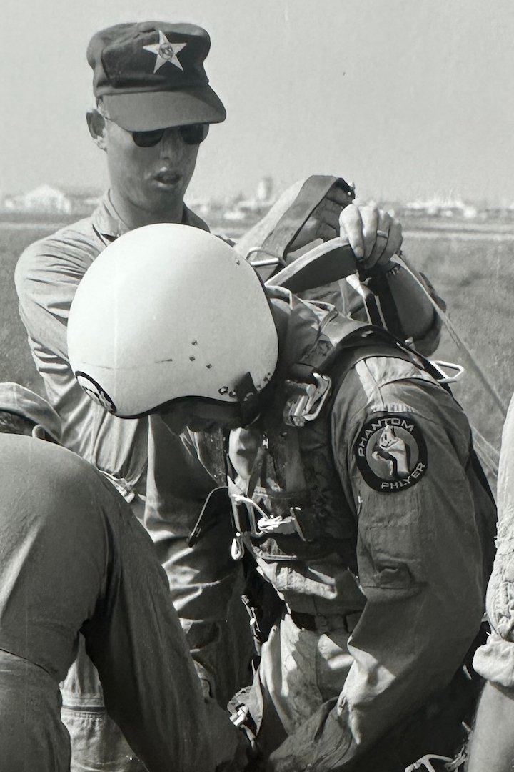 Coy Martin training an astronaut on the proper procedures for parachuting.
