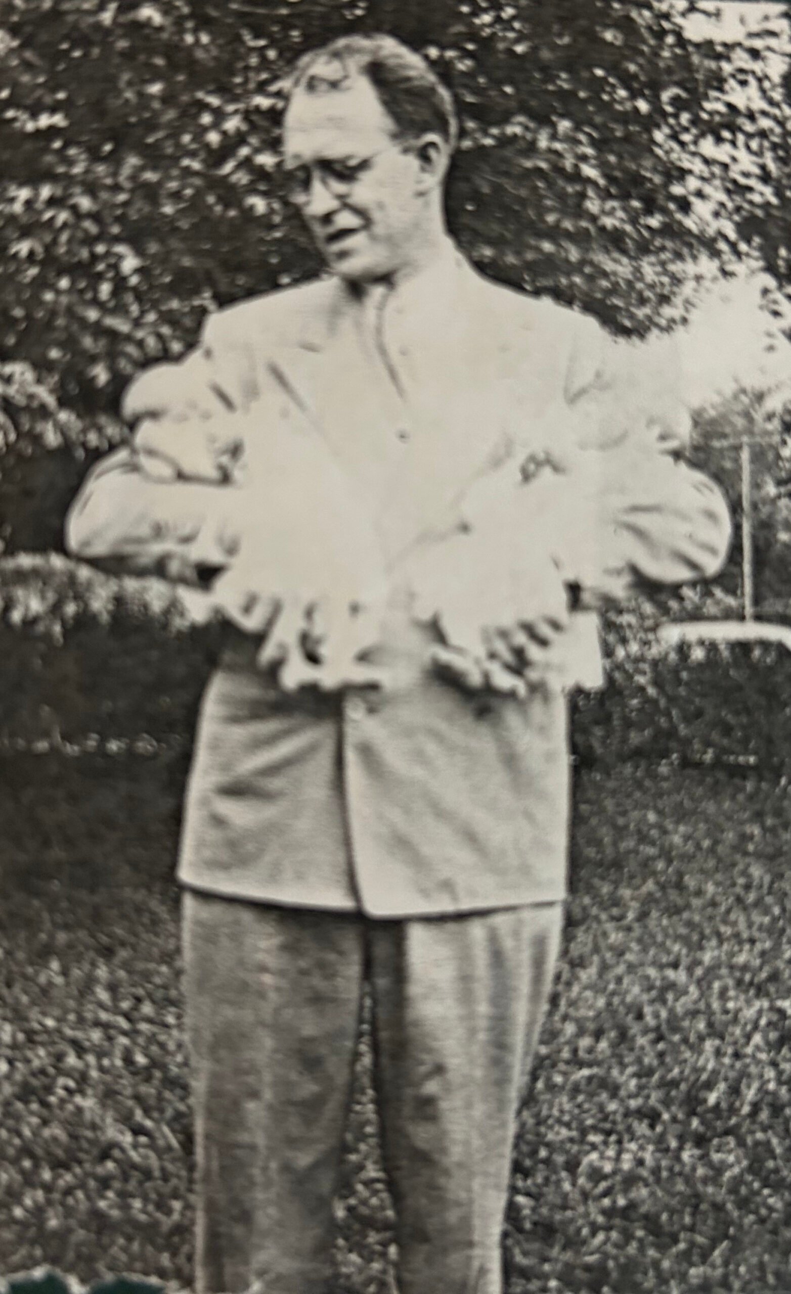 Ashtronaut Willard F Libby holding his twin daughters.