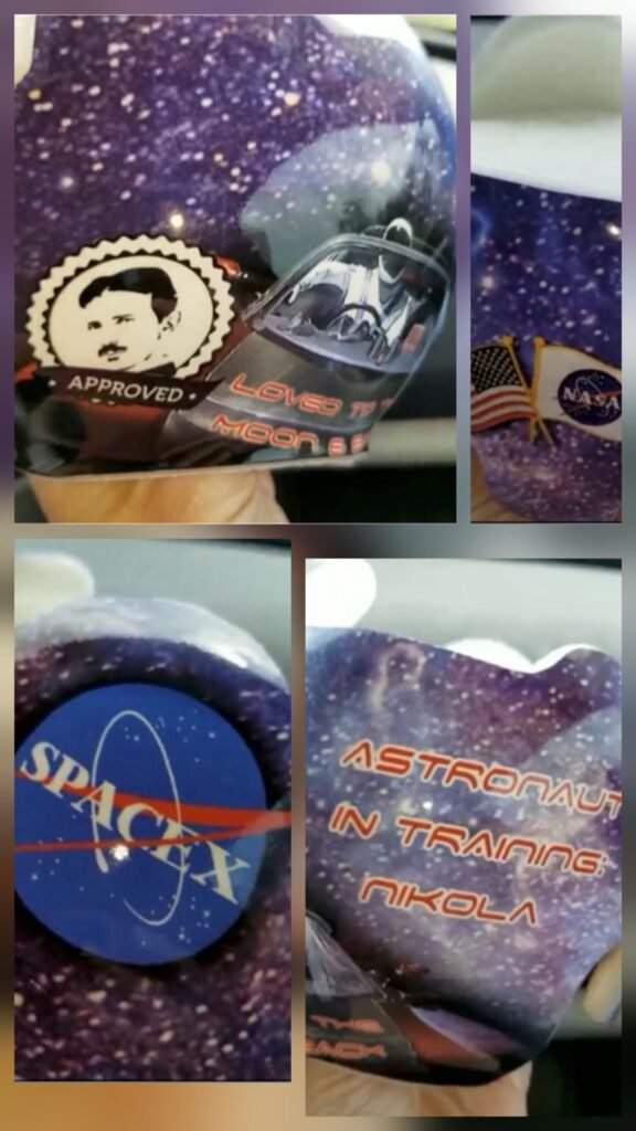 Space memorabilia honoring Kindyn Jinkins — SpaceX and NASA keepsakes, a Nikola Tesla tribute, and Astronaut in Training tags celebrating his lifelong passion for space exploration.
