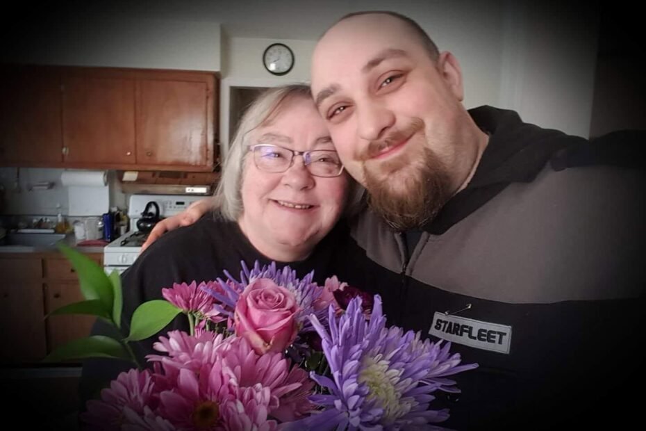 Ashtronaut Barbara Giaquinto with her loving son Matty, holding a bouquet of flowers.