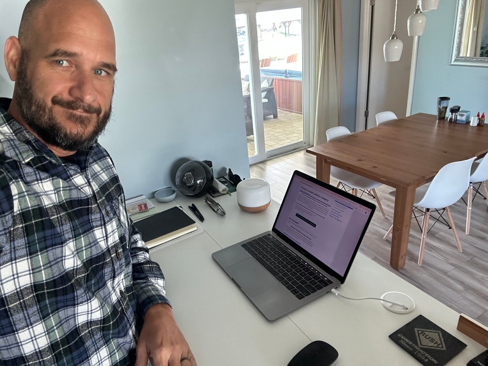 Space Beyond founder Ryan Mitchell standing by his laptop, the moment he established Space Beyond.