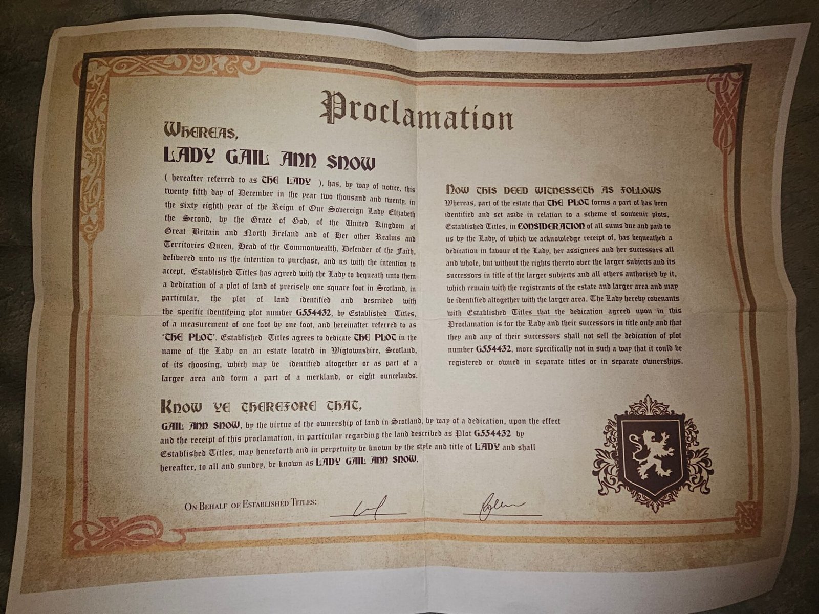 The Scottish land proclamation certificate naming Gail Ann Snow a Lady, with a decorative crest and red border.