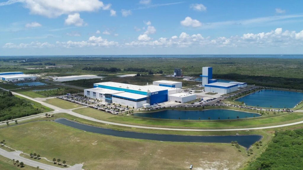 Aerial view of Blue Origin's launch site support facilities on Florida's Space Coast, surrounded by retention ponds and scrubland.