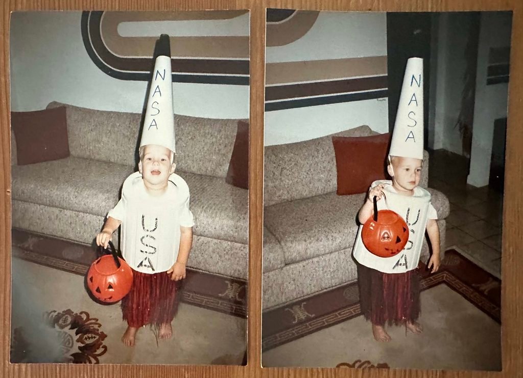 Space Beyond founder Ryan Mitchell as a young child dressed in a homemade rocket costume for Halloween, wearing a cone-shaped NASA hat and a cut-up trash can as the rocket body, holding a jack-o-lantern candy pail.